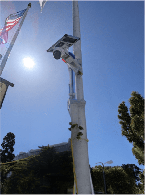 A Rapid Deploy camera and solar panel mounted on a pole at a live site